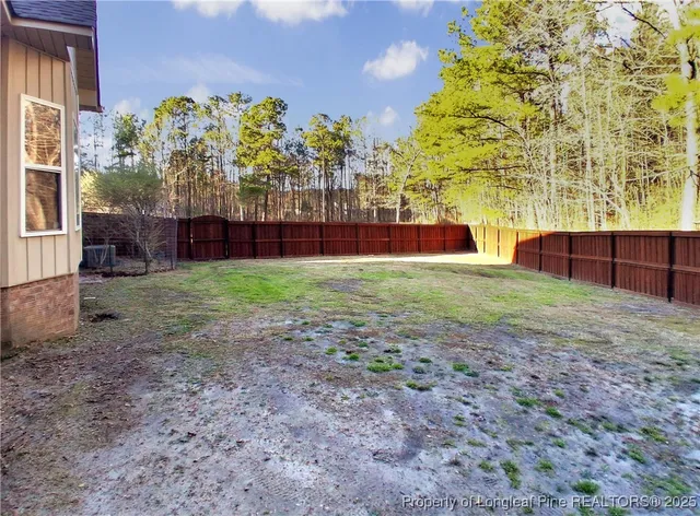 a view of a yard with a large trees