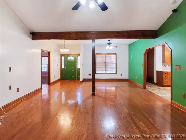 a view of an entryway with wooden floor