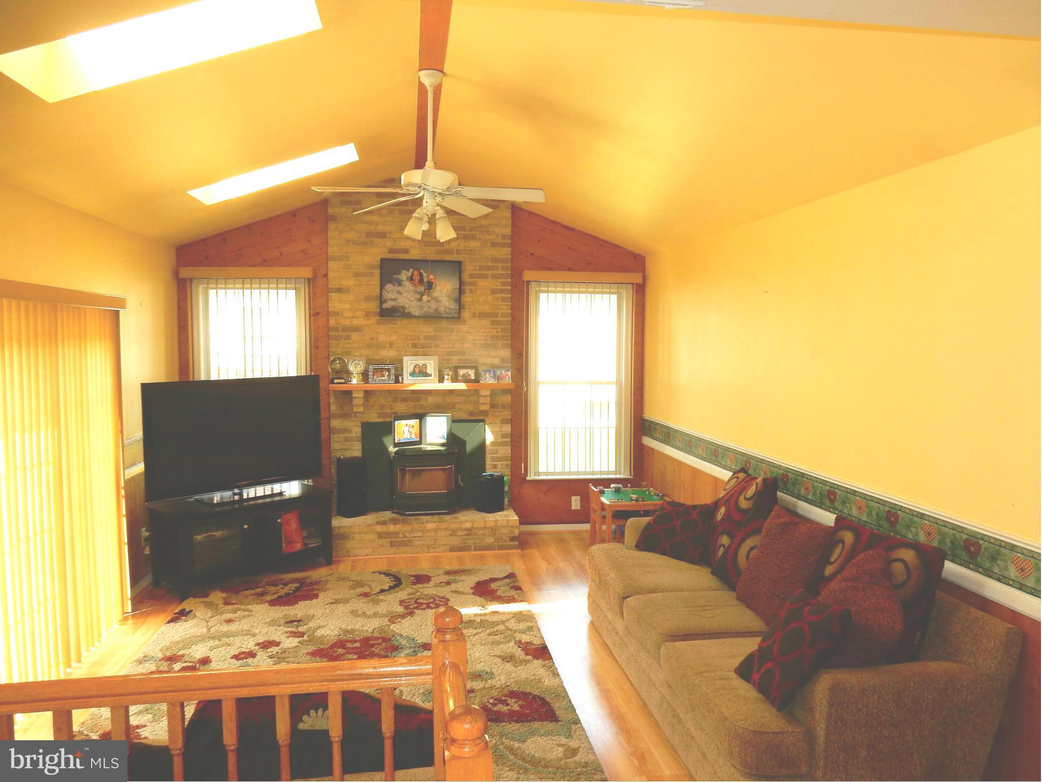 725 Rosewood Road Severn, MD 21144 - Photo 6 of 29 Cathedral Ceiling with Skylights and Fireplace