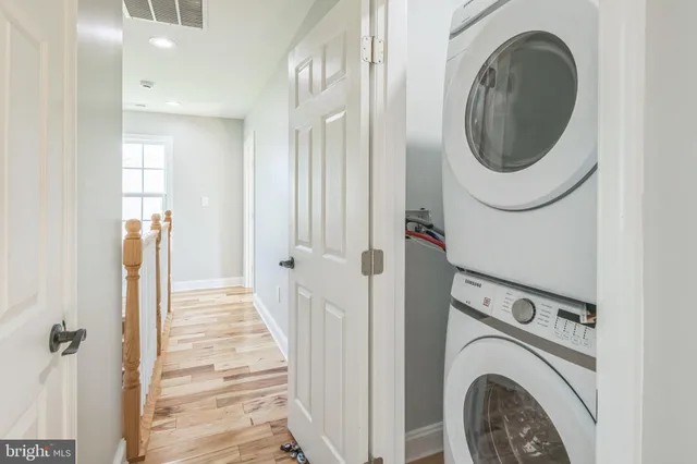 a view of a hallway with washer and dryer