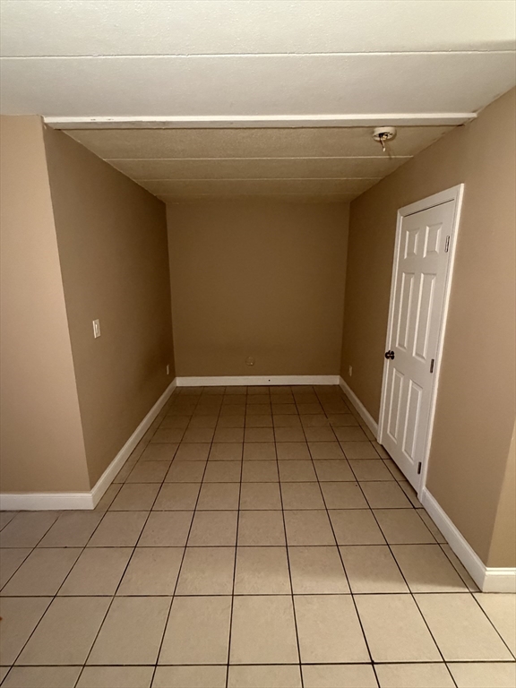 126 Beaver Street, Unit 65 Framingham, MA 01702 - Photo 6 of 15 a view of an empty room and window