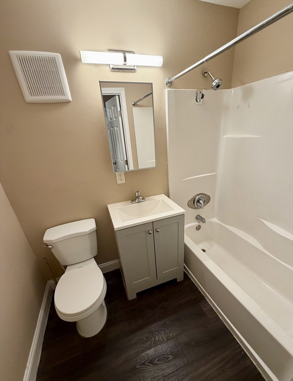 126 Beaver Street, Unit 65 Framingham, MA 01702 - Photo 7 of 15 a bathroom with a toilet a sink and bathtub