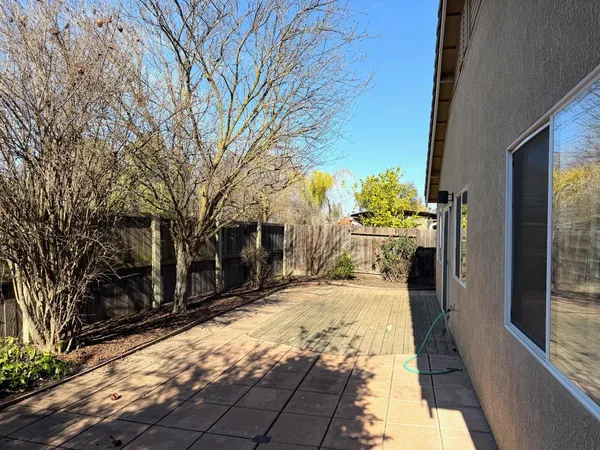 a view of a backyard of the house