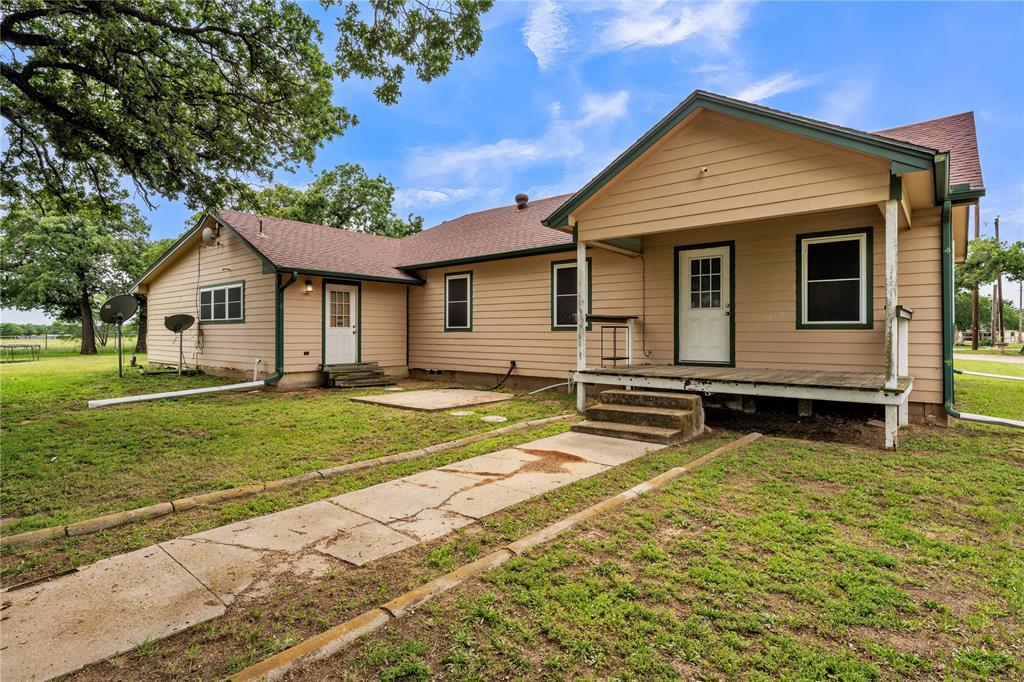 209 Dixie Road Millsap, TX 76066 - Photo 5 of 31 a view of a house with a yard and sitting area