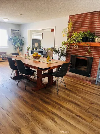 a living room with furniture a fireplace and a table