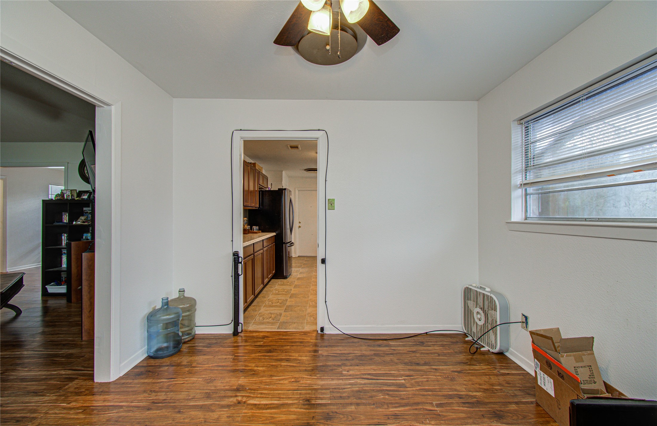 1710 West 11th Street Freeport, TX 77541 - Photo 13 of 34 a view of empty room with wooden floor