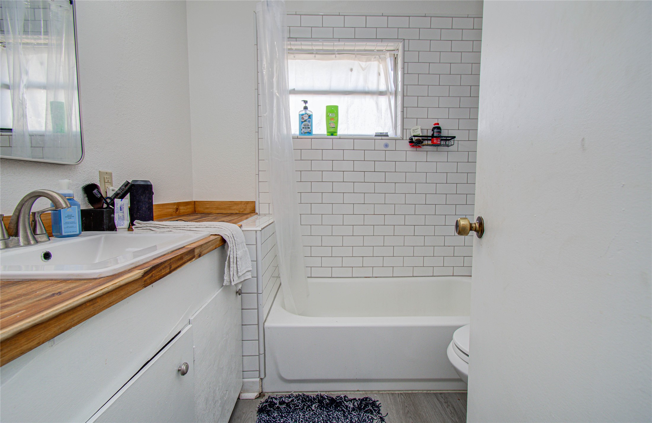 1710 West 11th Street Freeport, TX 77541 - Photo 25 of 34 a bathroom with a sink toilet and shower