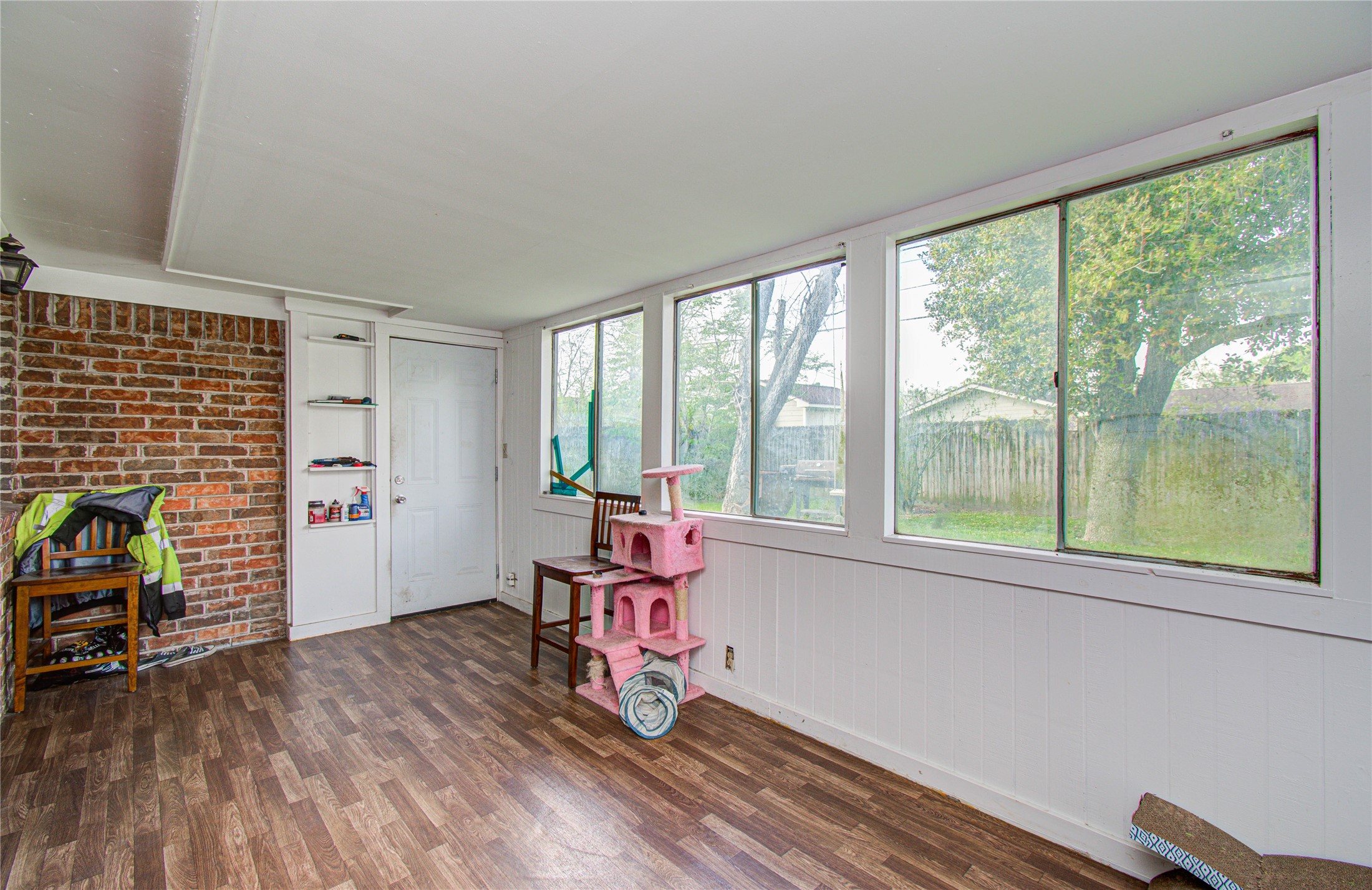 1710 West 11th Street Freeport, TX 77541 - Photo 29 of 34 a view of a livingroom with lounge chair and a large window