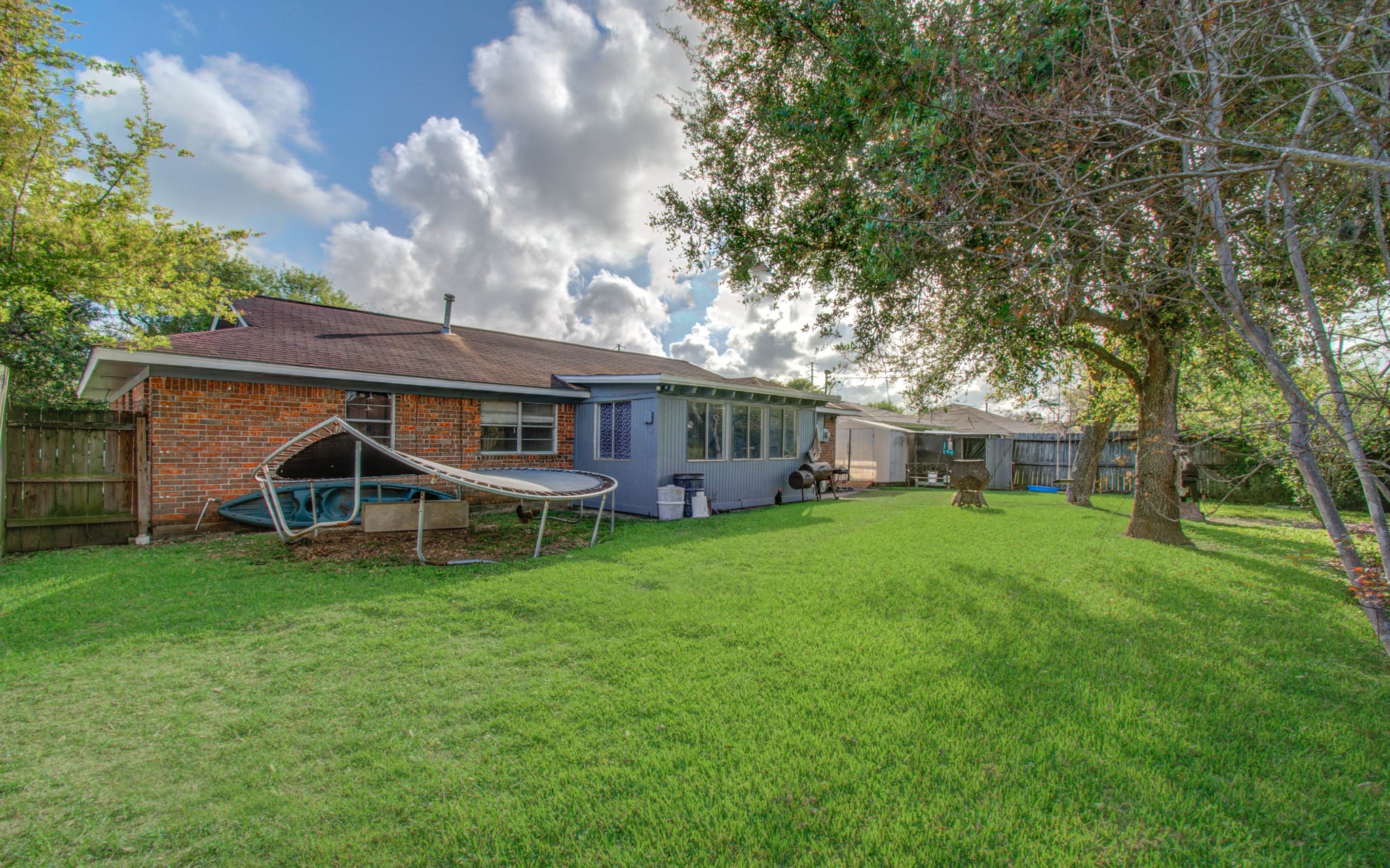 1710 West 11th Street Freeport, TX 77541 - Photo 33 of 34 a view of a house with a yard