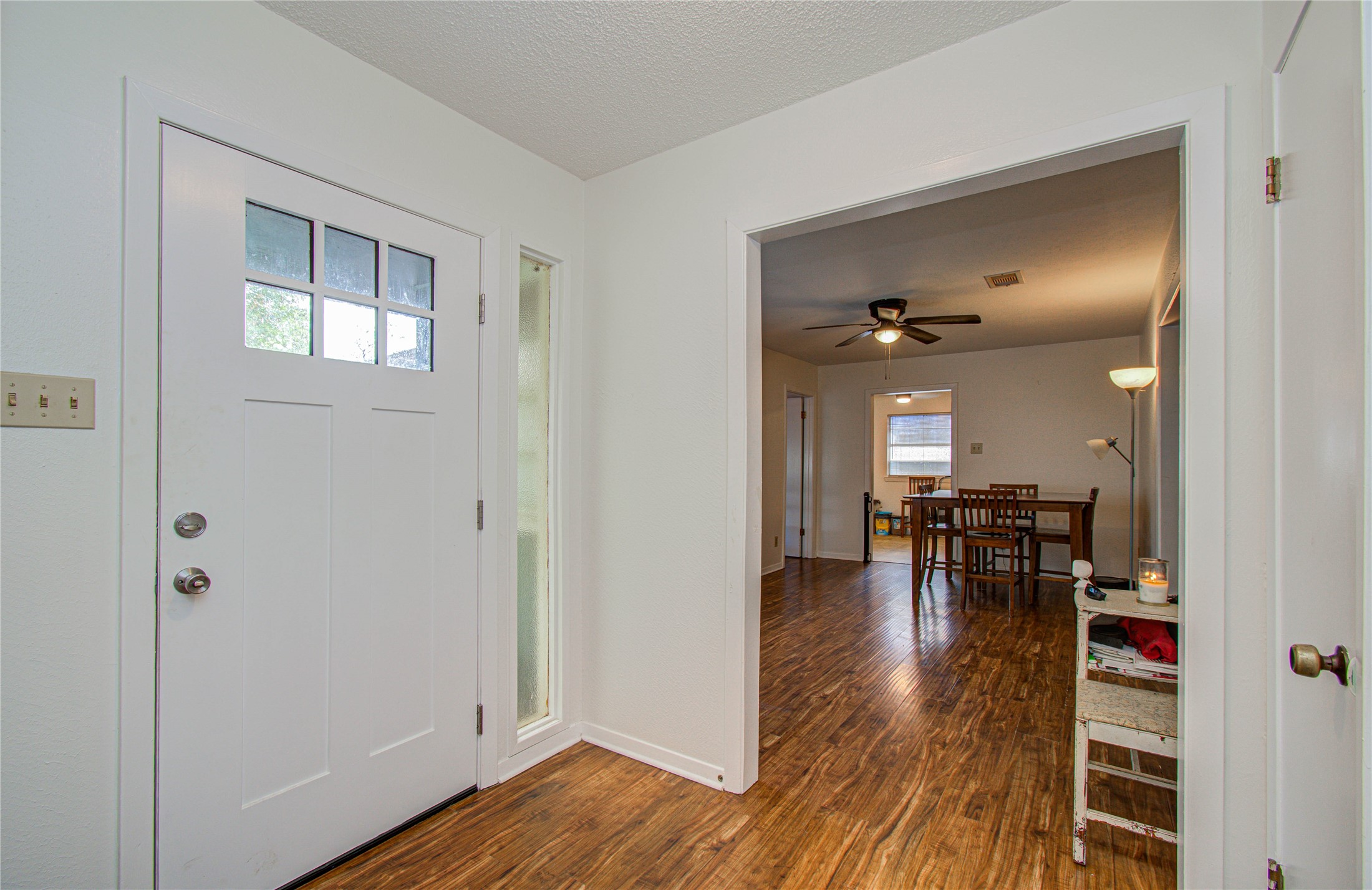 1710 West 11th Street Freeport, TX 77541 - Photo 6 of 34 a view of a livingroom with furniture wooden floor and a kitchen