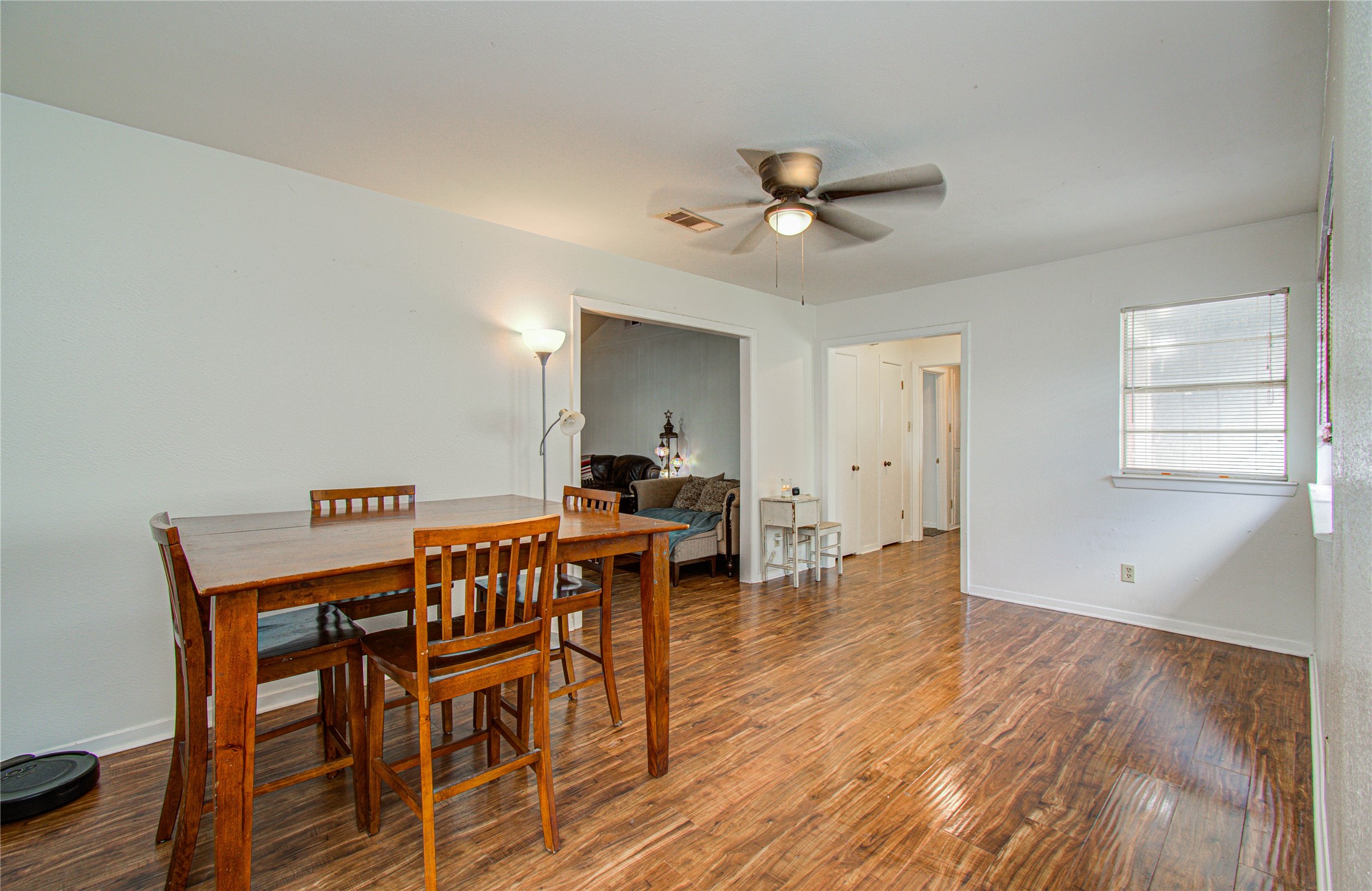 1710 West 11th Street Freeport, TX 77541 - Photo 8 of 34 a view of a dining room with furniture and wooden floor