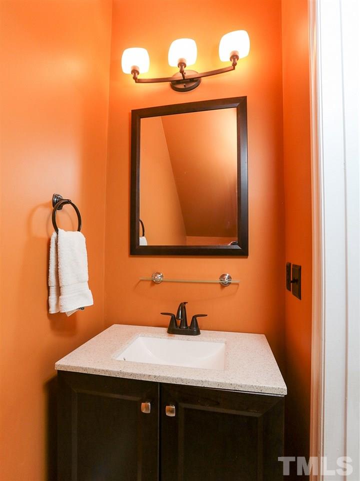 8204 Shadow Stone Court Raleigh, NC 27613 - Photo 11 of 21 a bathroom with a sink a mirror and vanity