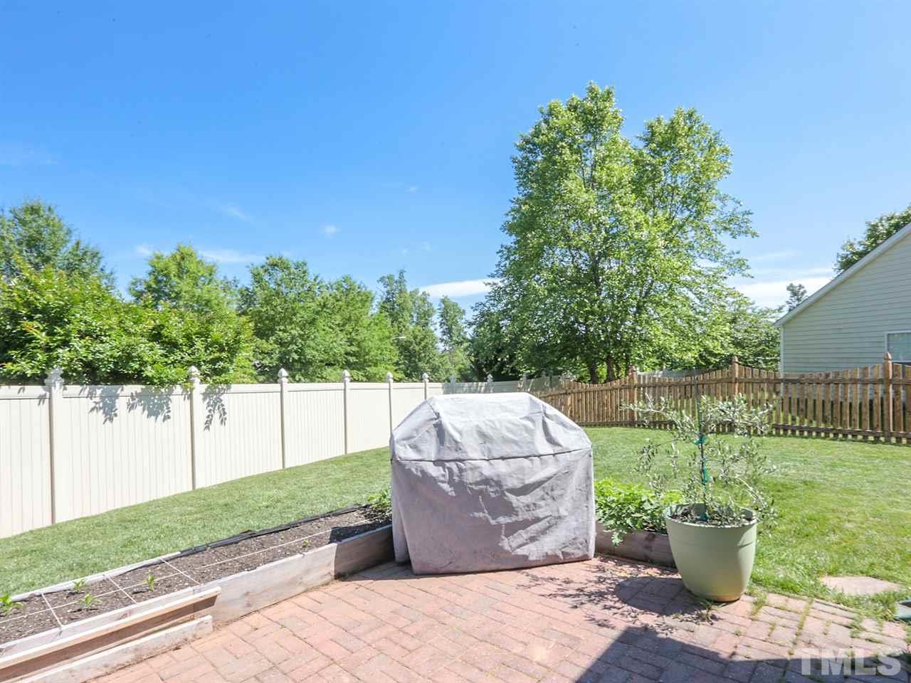 8204 Shadow Stone Court Raleigh, NC 27613 - Photo 19 of 21 a view of a garden with potted plants