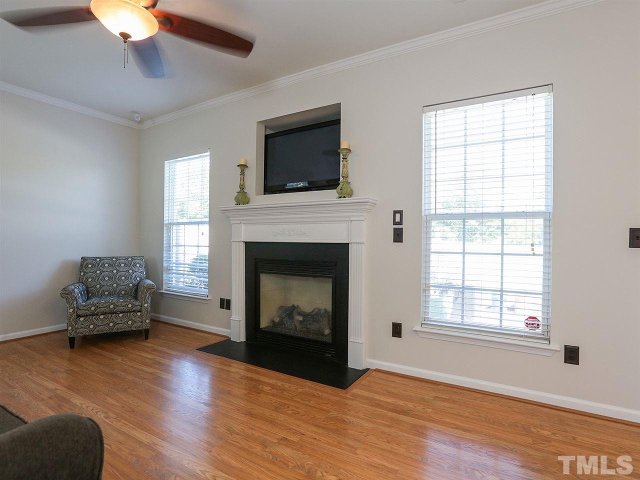 8204 Shadow Stone Court Raleigh, NC 27613 - Photo 6 of 21 a living room with furniture and a fireplace