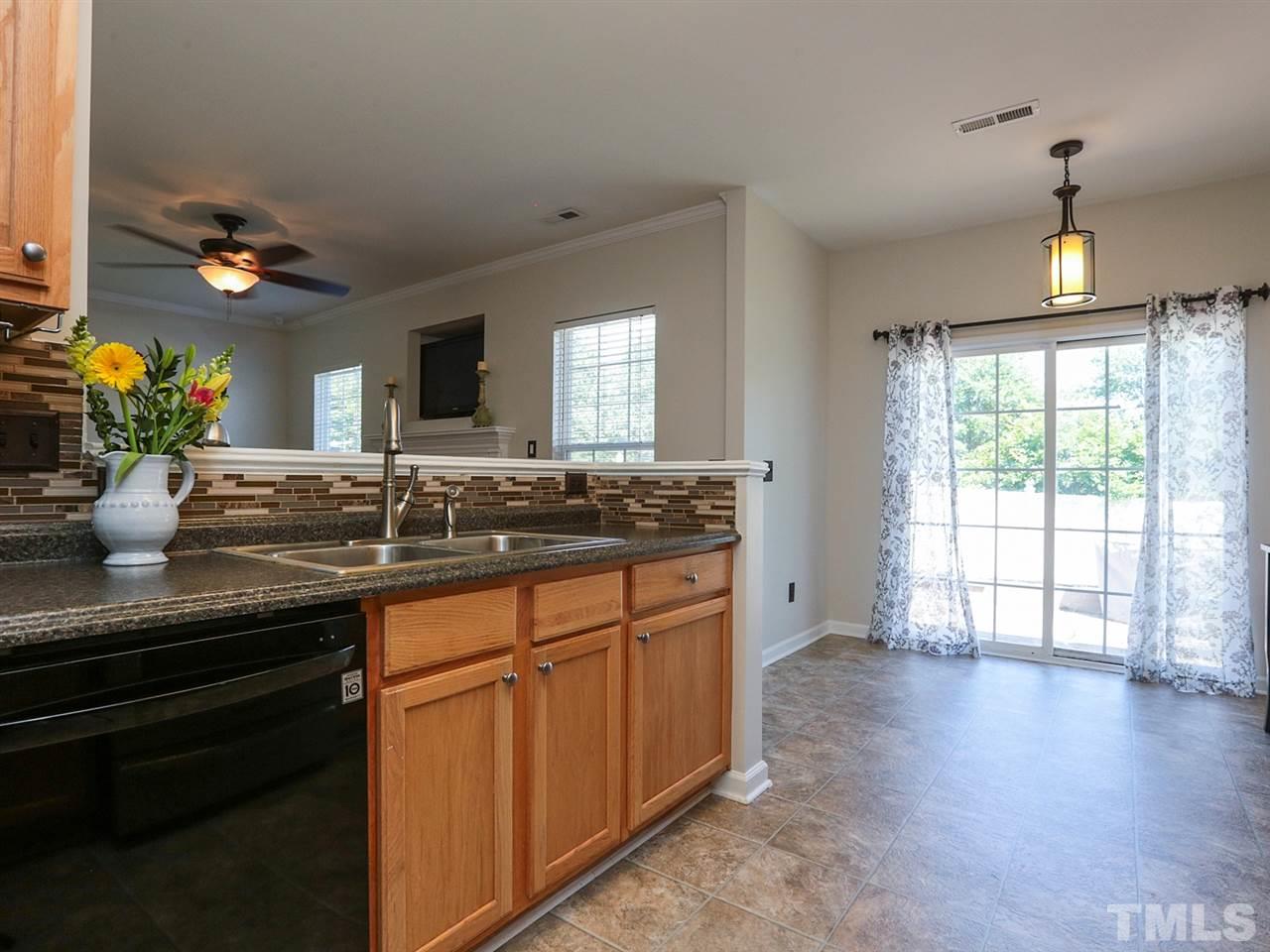 8204 Shadow Stone Court Raleigh, NC 27613 - Photo 8 of 21 a bathroom with a granite countertop sink a large mirror and a window