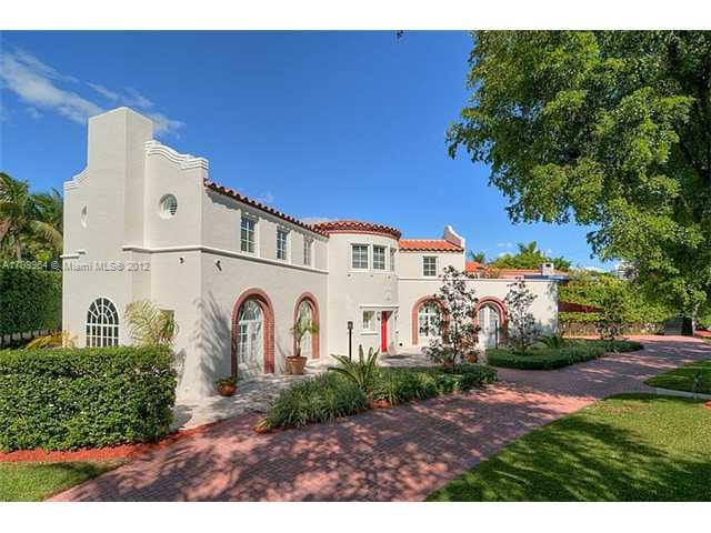 5100 La Gorce Drive Miami Beach, FL 33140 - Photo 1 of 25 a view of a white house with a big yard and large tree