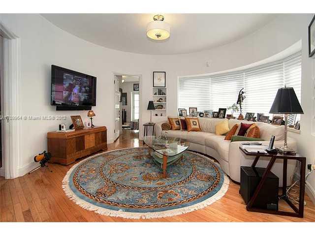 5100 La Gorce Drive Miami Beach, FL 33140 - Photo 11 of 25 a living room with furniture and a flat screen tv