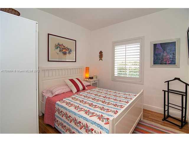 5100 La Gorce Drive Miami Beach, FL 33140 - Photo 12 of 25 a bedroom with a bed and a window