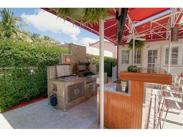 5100 La Gorce Drive Miami Beach, FL 33140 - Photo 19 of 25 a kitchen view of a house with a garden and patio