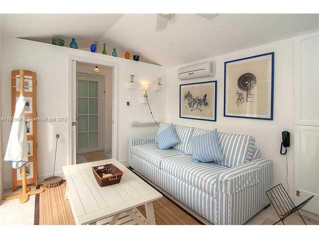 5100 La Gorce Drive Miami Beach, FL 33140 - Photo 24 of 25 a living room with furniture and a window