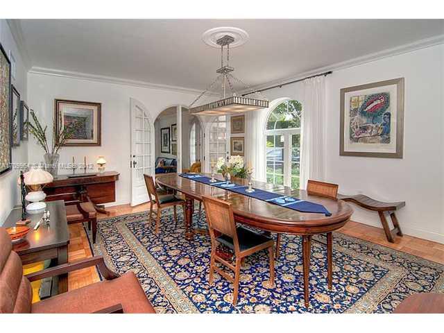 5100 La Gorce Drive Miami Beach, FL 33140 - Photo 5 of 25 a living room with furniture a window and a chandelier