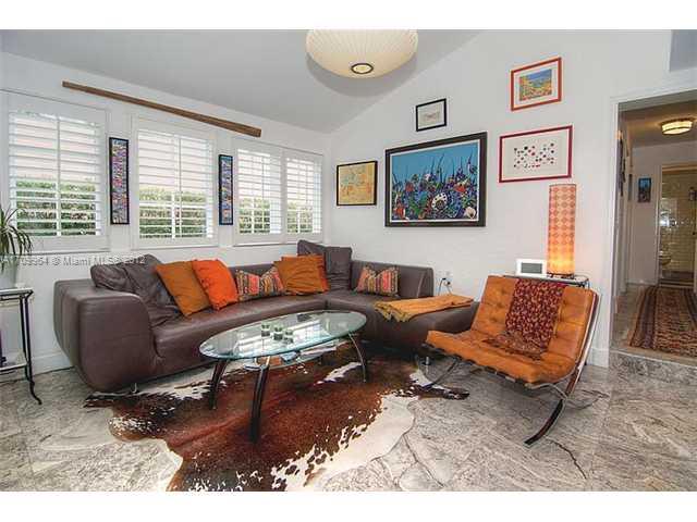 5100 La Gorce Drive Miami Beach, FL 33140 - Photo 7 of 25 a living room with furniture and a large window