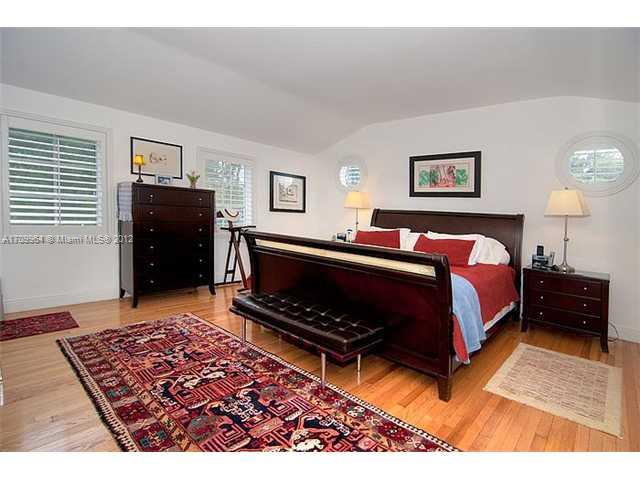 5100 La Gorce Drive Miami Beach, FL 33140 - Photo 8 of 25 a bedroom with a bed and a dresser