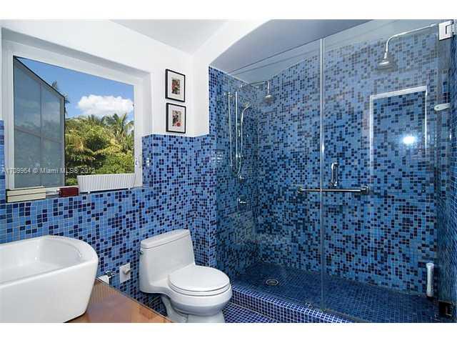 5100 La Gorce Drive Miami Beach, FL 33140 - Photo 10 of 25 a bathroom with a toilet a sink and bathtub