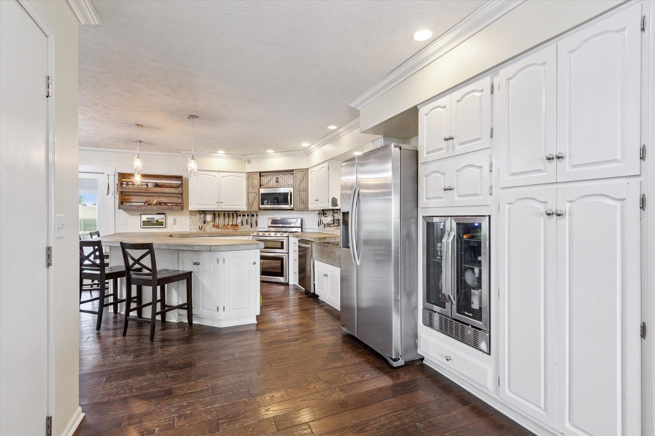 8548 East Edwardsville Road German Valley, IL 61039 - Photo 12 of 70 a kitchen with white cabinets and stainless steel appliances