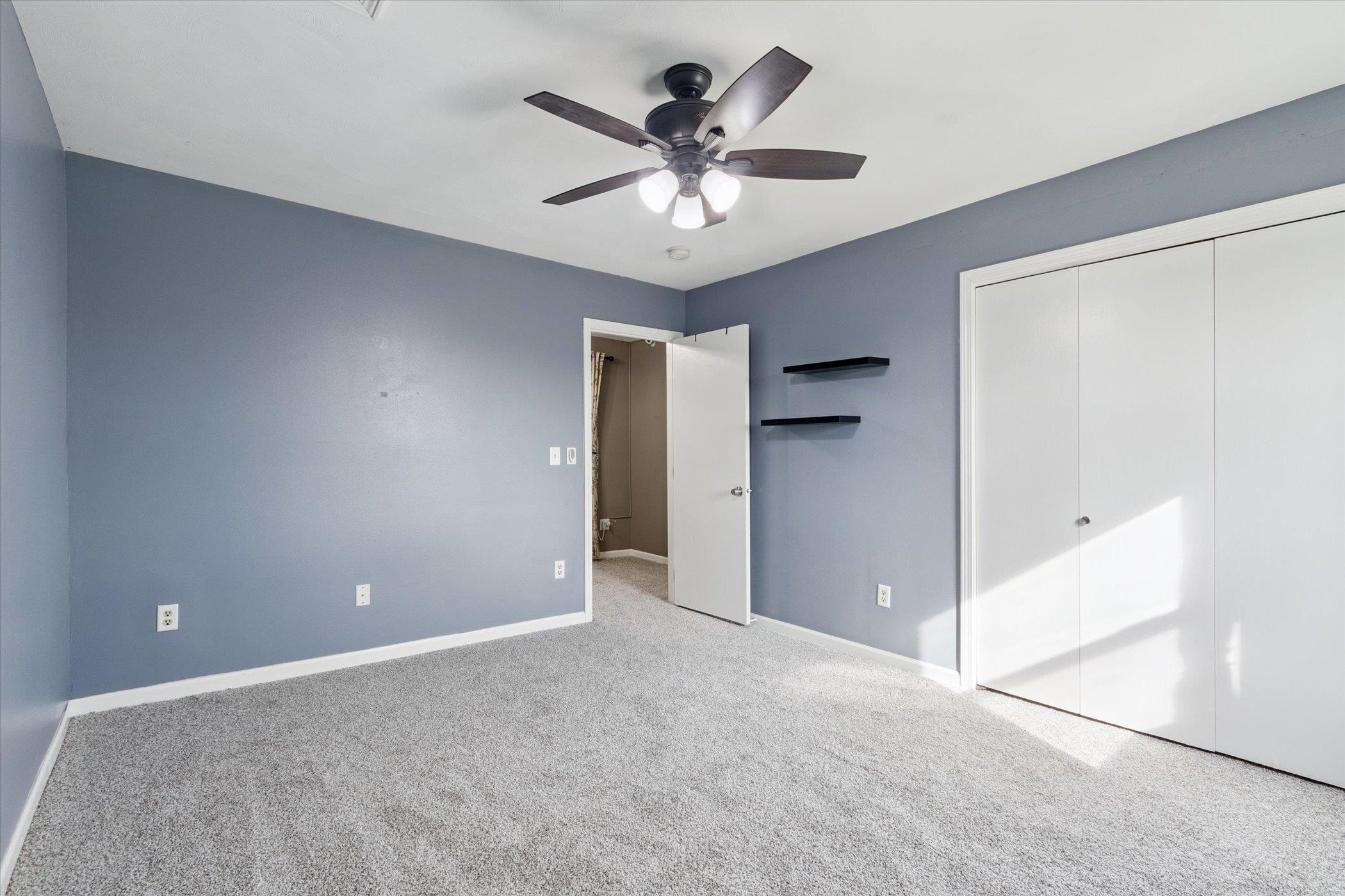 8548 East Edwardsville Road German Valley, IL 61039 - Photo 22 of 70 a view of an empty room with a ceiling fan