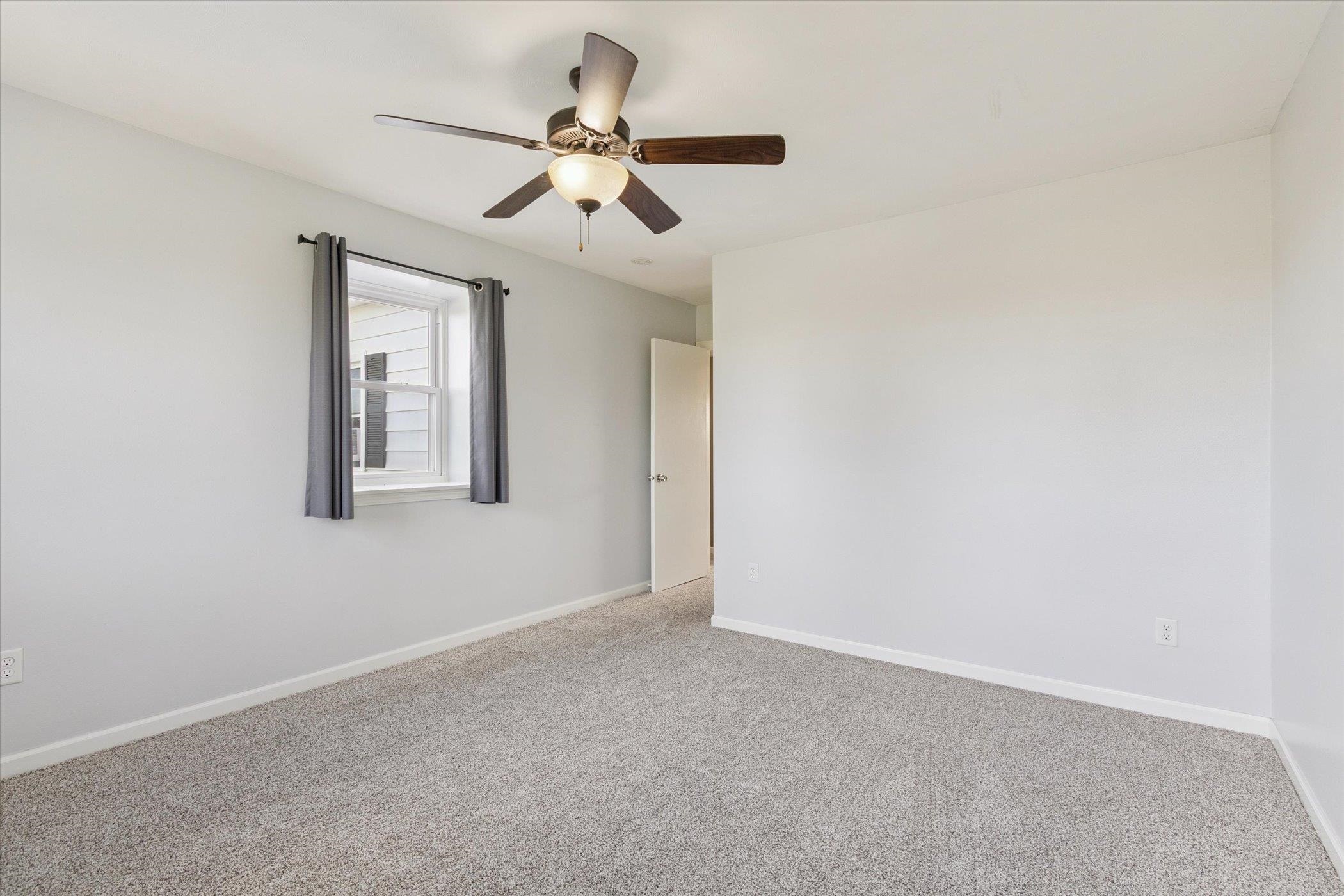 8548 East Edwardsville Road German Valley, IL 61039 - Photo 24 of 70 a view of an empty room with a chandelier fan