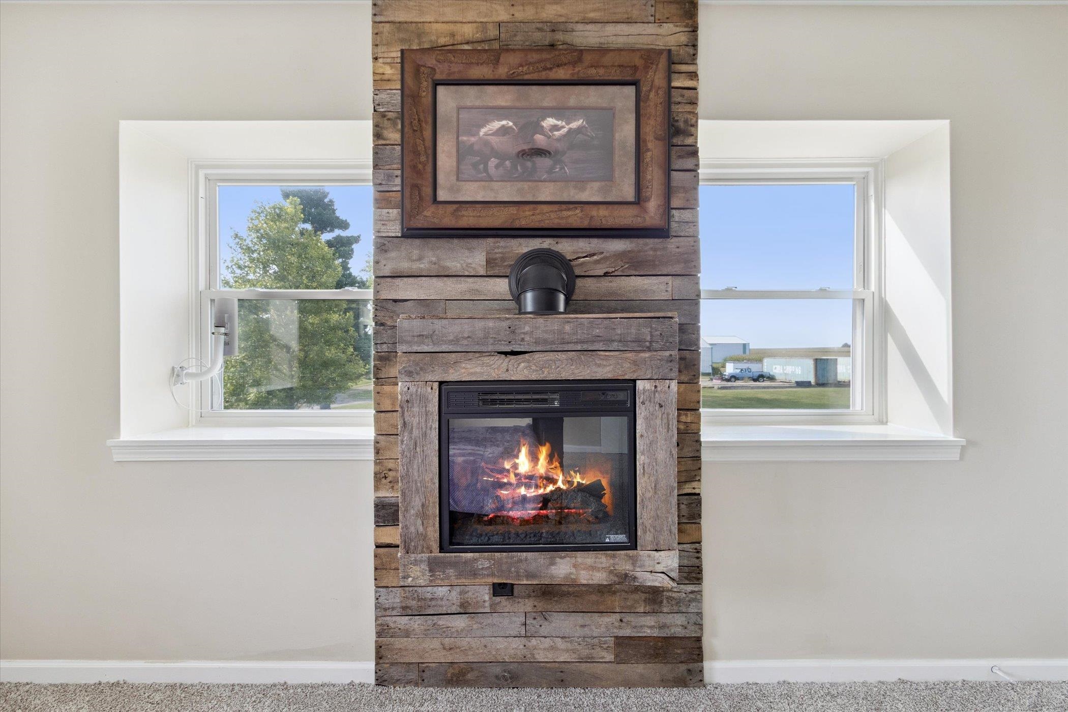 8548 East Edwardsville Road German Valley, IL 61039 - Photo 27 of 70 a living room with a fireplace windows and a fireplace