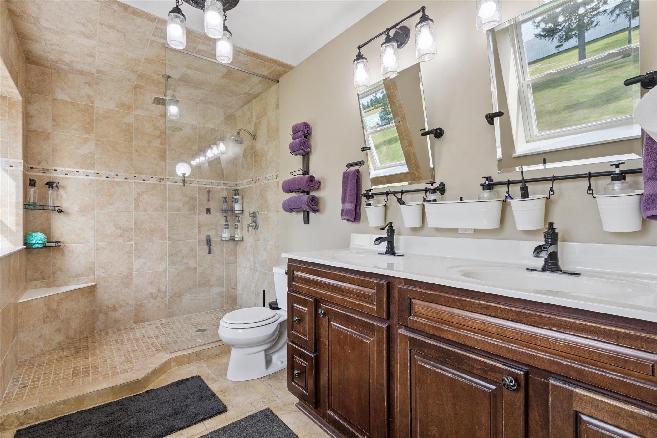 8548 East Edwardsville Road German Valley, IL 61039 - Photo 28 of 70 a bathroom with a sink a toilet and a mirror