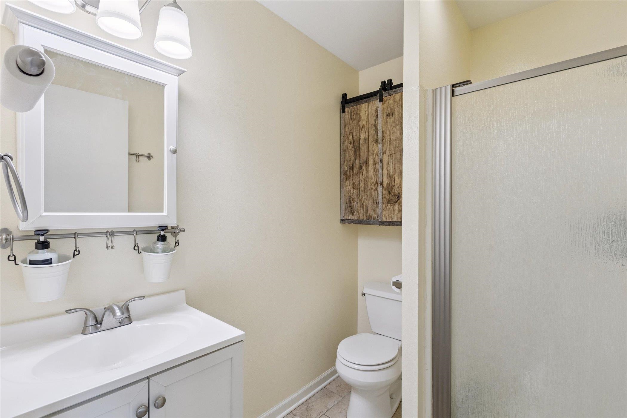 8548 East Edwardsville Road German Valley, IL 61039 - Photo 40 of 70 a bathroom with a sink toilet and shower