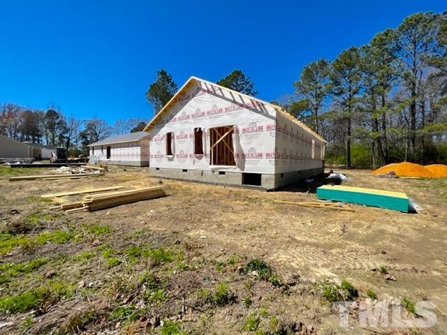 756 Bear Road Benson, NC 27504 - Photo 8 of 22 a front view of a house with a yard