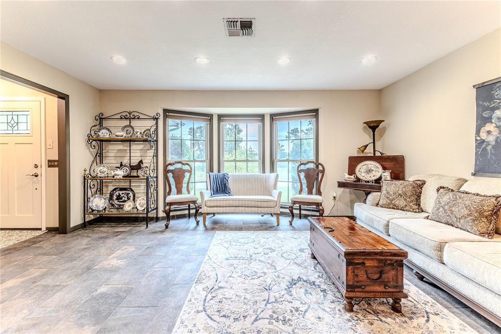 8480 Colma Street Spring Hill, FL 34606 - Photo 12 of 70 a living room with furniture and a window