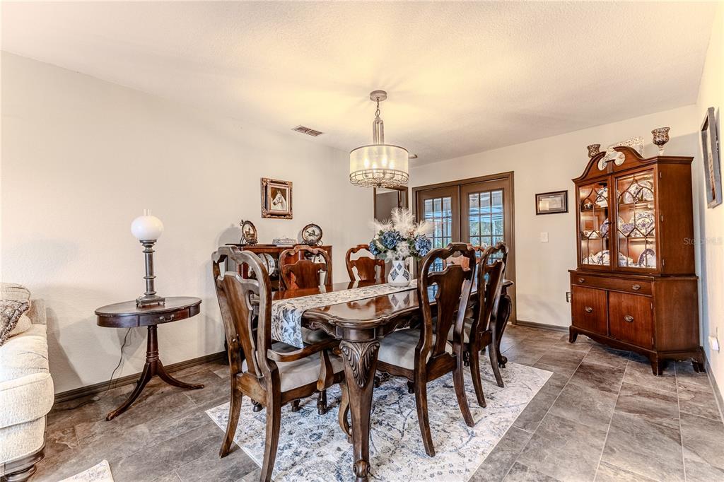 8480 Colma Street Spring Hill, FL 34606 - Photo 16 of 70 a view of a dining room with furniture and window