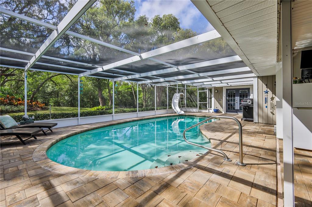 8480 Colma Street Spring Hill, FL 34606 - Photo 2 of 70 a view of a swimming pool with a patio