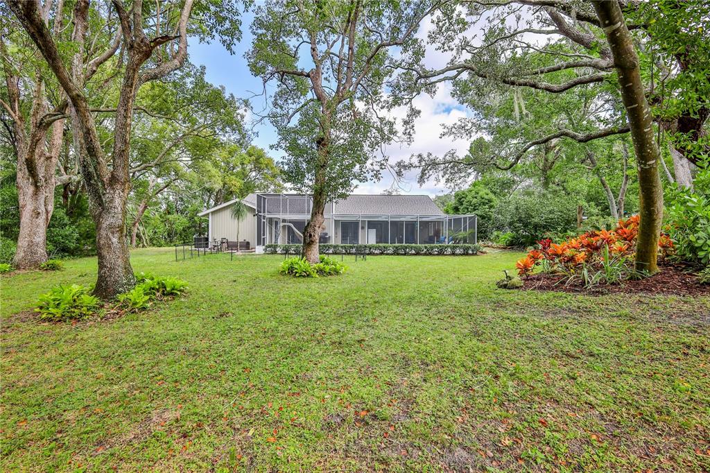 8480 Colma Street Spring Hill, FL 34606 - Photo 55 of 70 a front view of a house with a yard