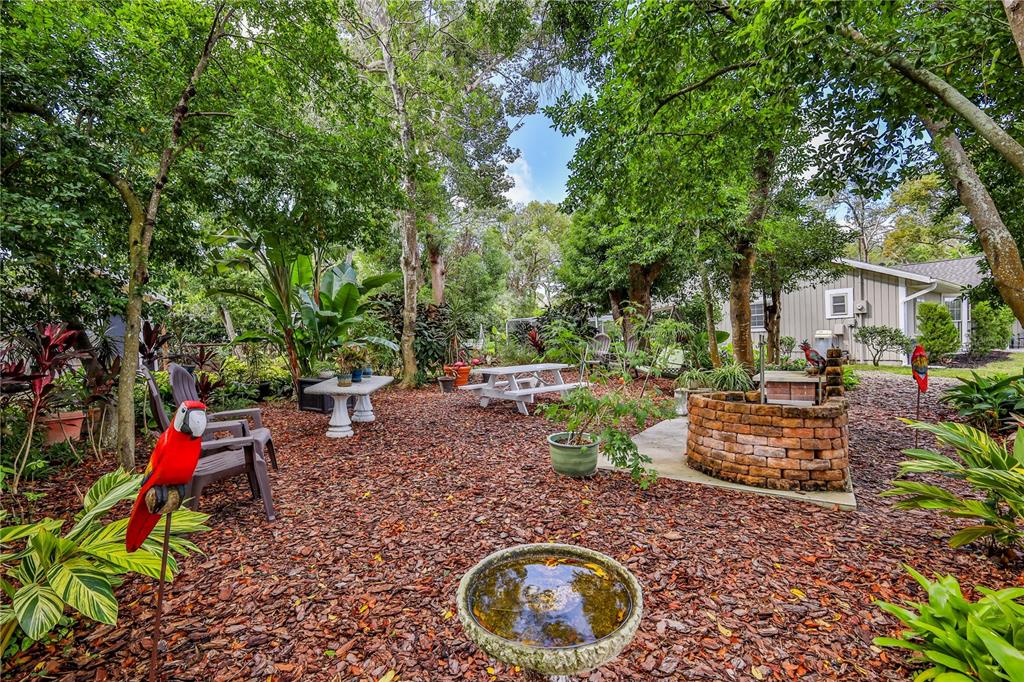 8480 Colma Street Spring Hill, FL 34606 - Photo 62 of 70 a backyard of a house with a yard and outdoor seating