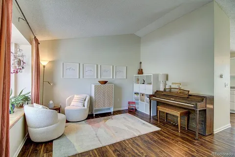 a bedroom with furniture and a fireplace
