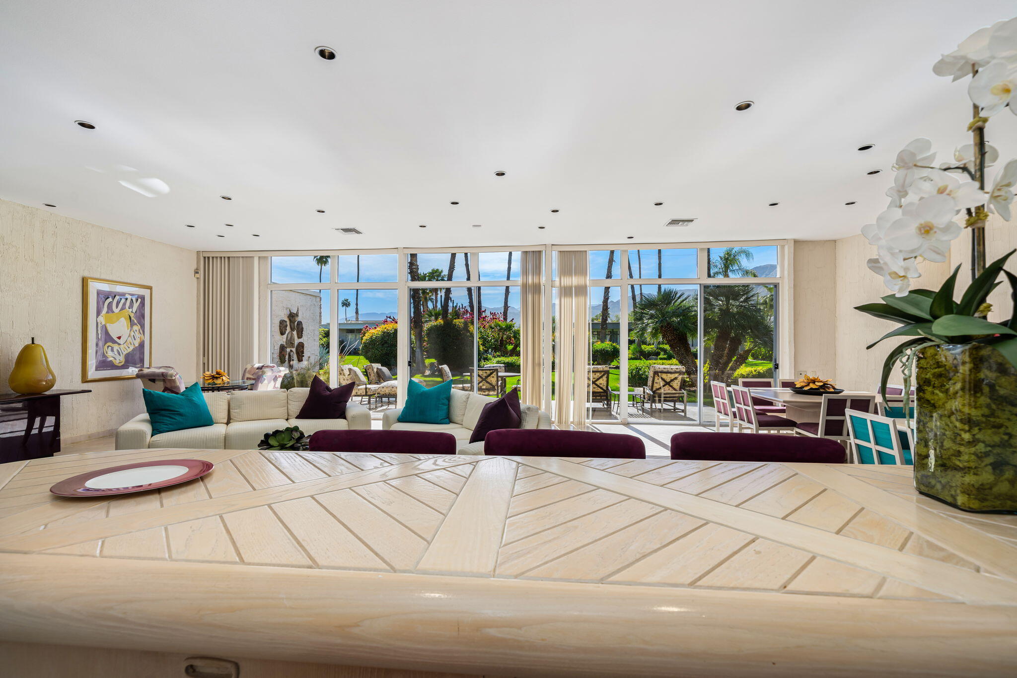1408 Tamarisk W Street Rancho Mirage, CA 92270 - Photo 16 of 43 a living room with furniture and large windows