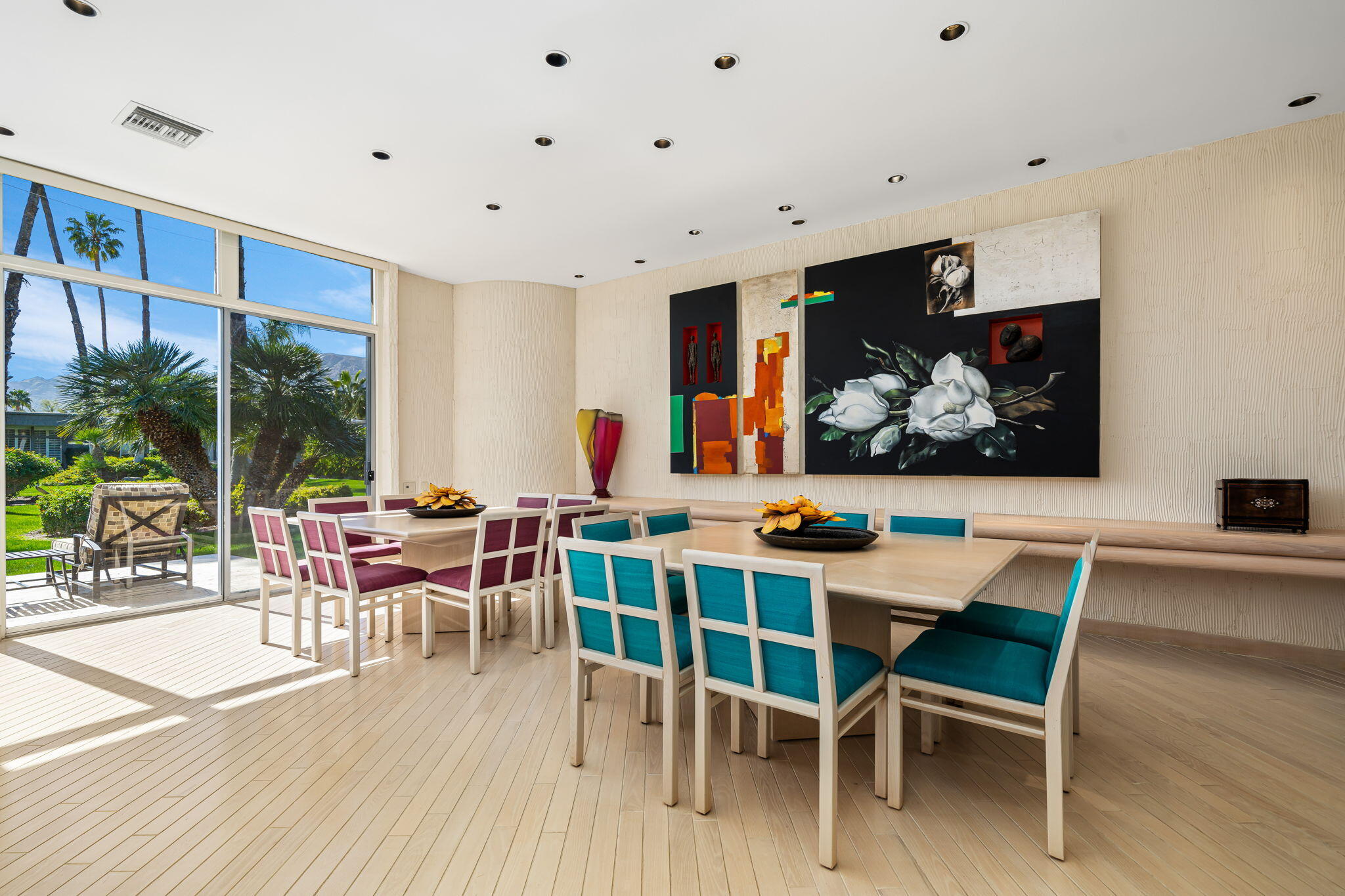 1408 Tamarisk W Street Rancho Mirage, CA 92270 - Photo 17 of 43 a view of a dining room with furniture wooden floor and painting on the wall