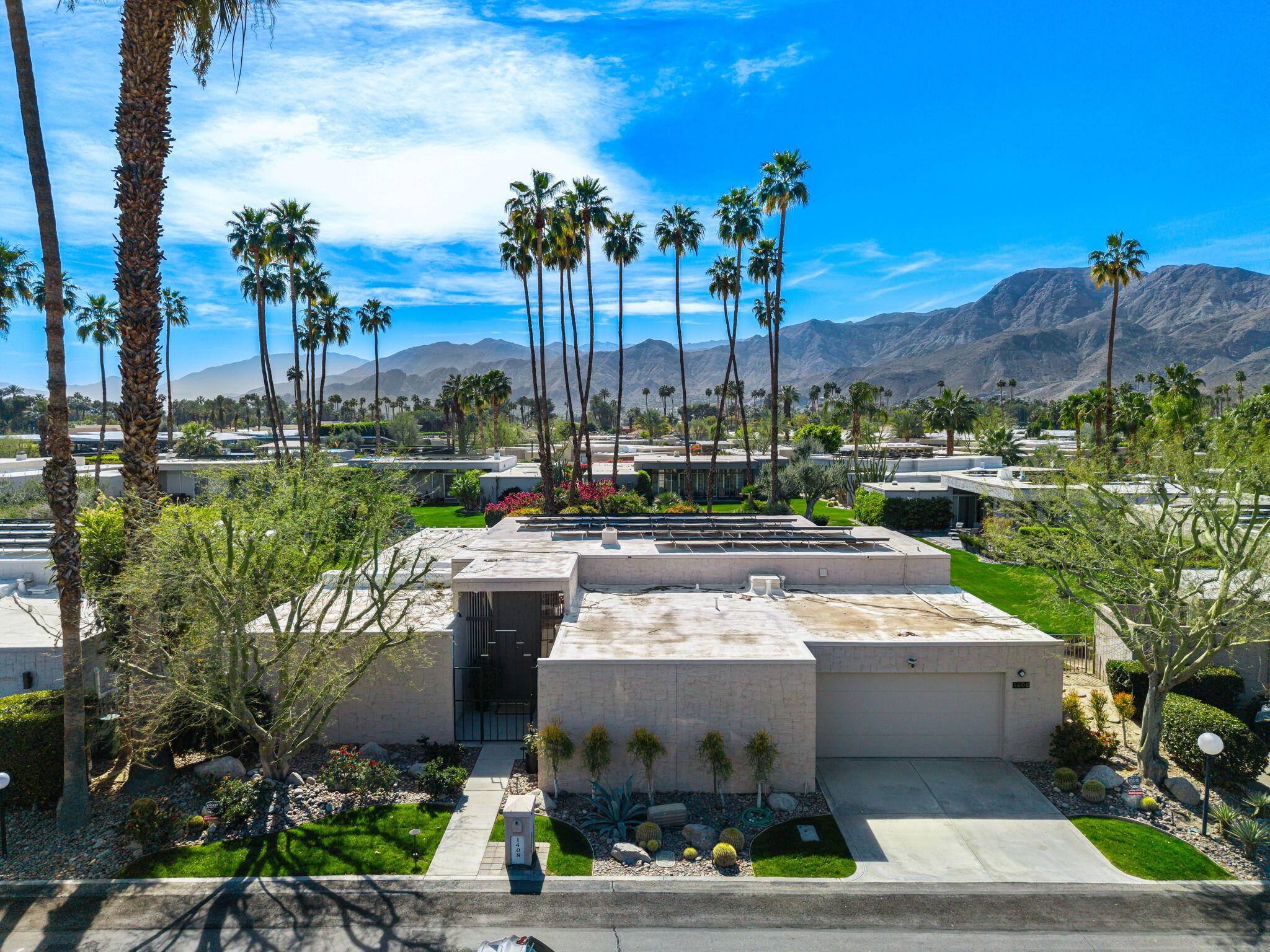 1408 Tamarisk W Street Rancho Mirage, CA 92270 - Photo 2 of 43 a view of a city with tall buildings