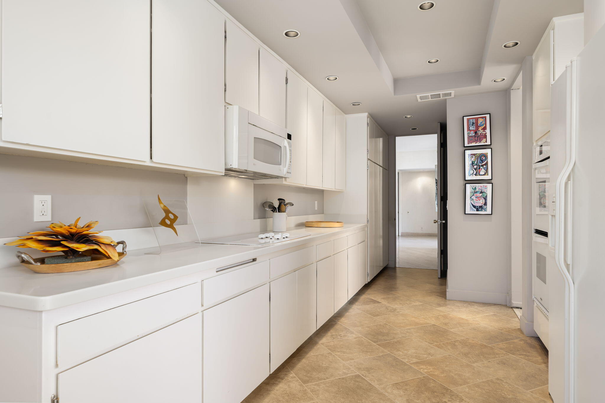 1408 Tamarisk W Street Rancho Mirage, CA 92270 - Photo 22 of 43 a kitchen with stainless steel appliances a cabinets and a refrigerator