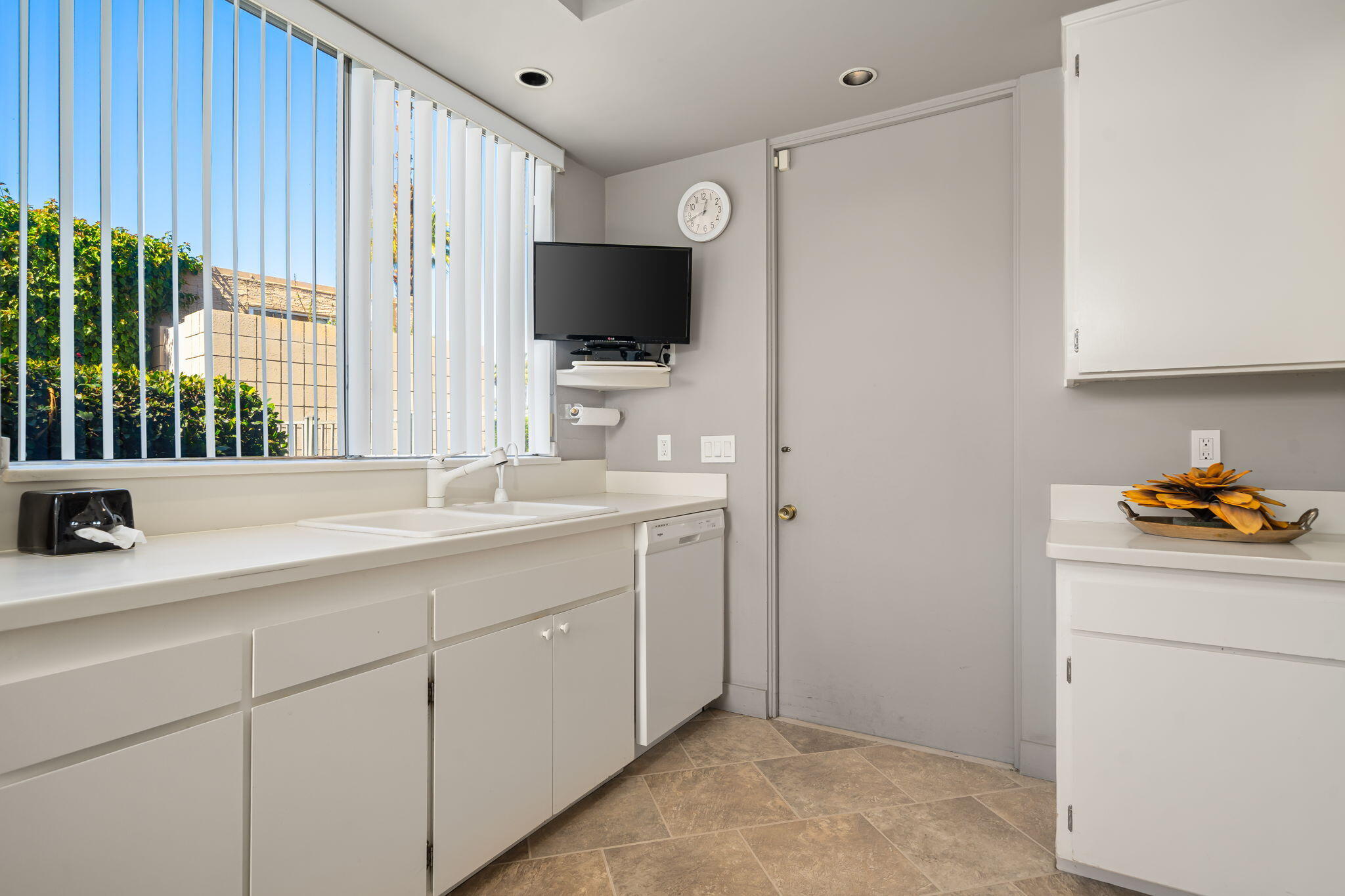 1408 Tamarisk W Street Rancho Mirage, CA 92270 - Photo 24 of 43 a bathroom with a sink and a mirror