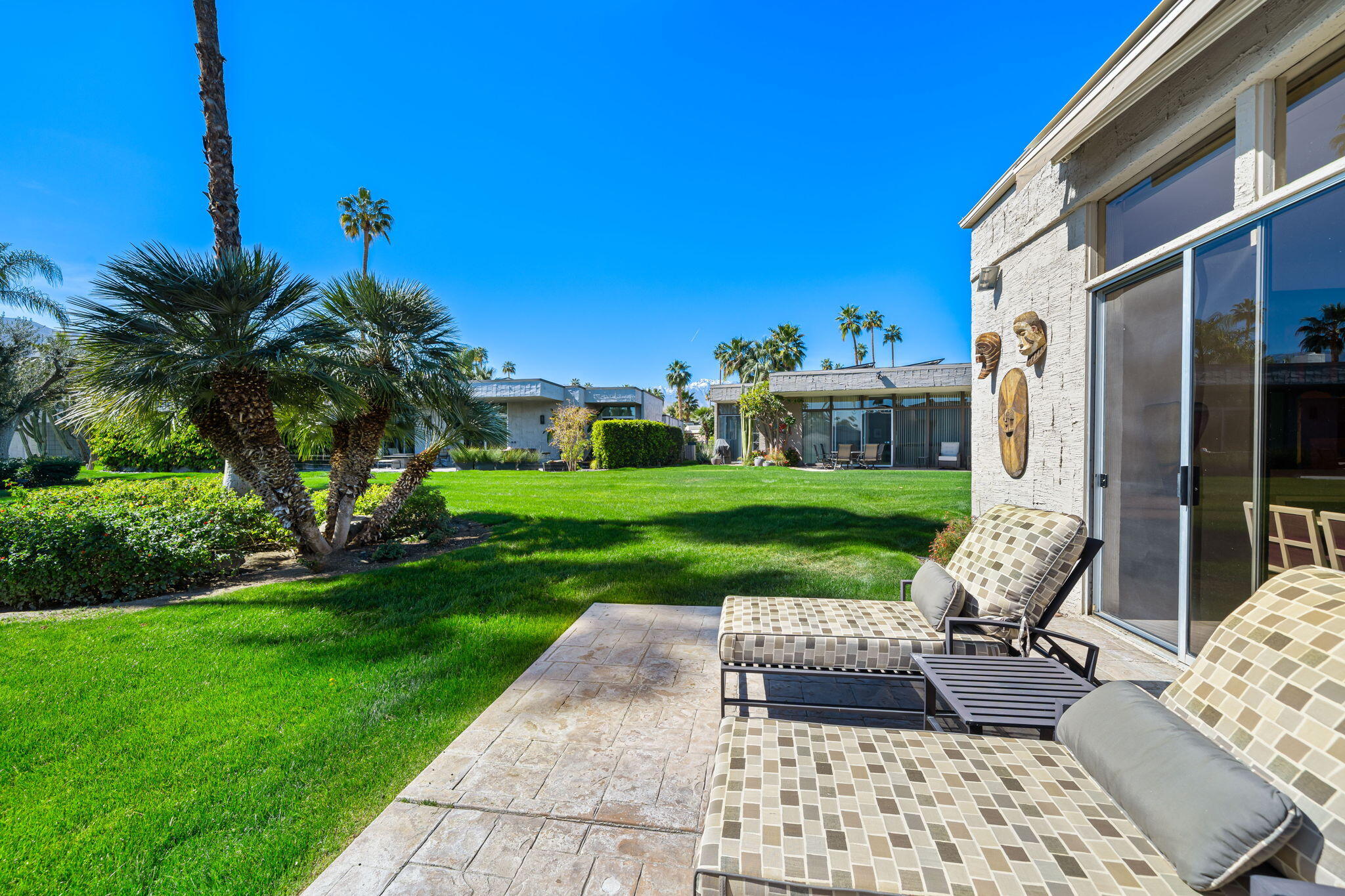 1408 Tamarisk W Street Rancho Mirage, CA 92270 - Photo 27 of 43 a view of a patio with a yard