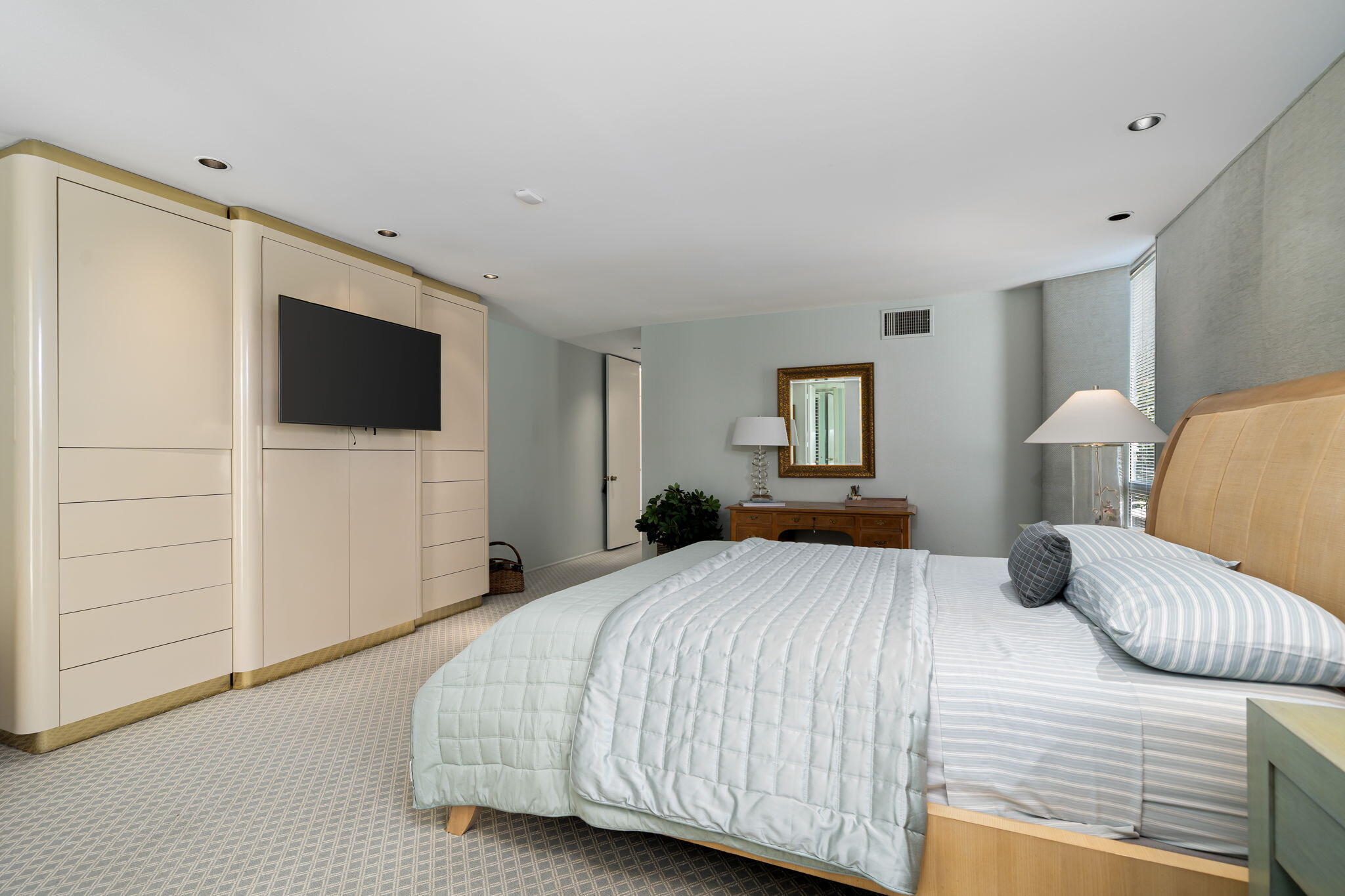 1408 Tamarisk W Street Rancho Mirage, CA 92270 - Photo 31 of 43 a bedroom with a bed and a flat screen tv