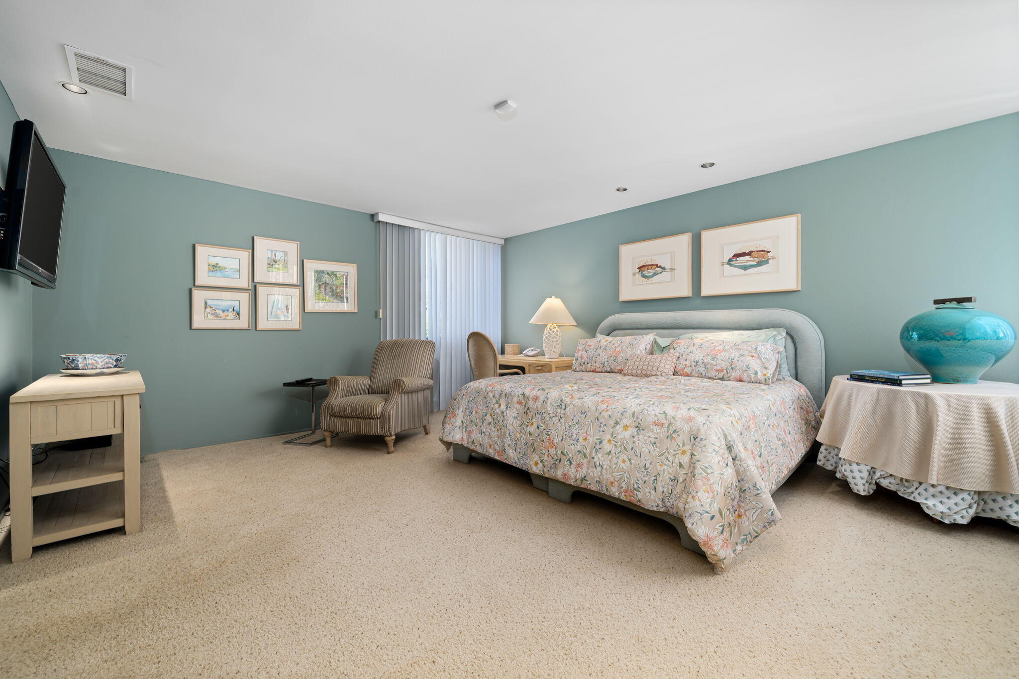 1408 Tamarisk W Street Rancho Mirage, CA 92270 - Photo 40 of 43 a bedroom with a bed and a couch