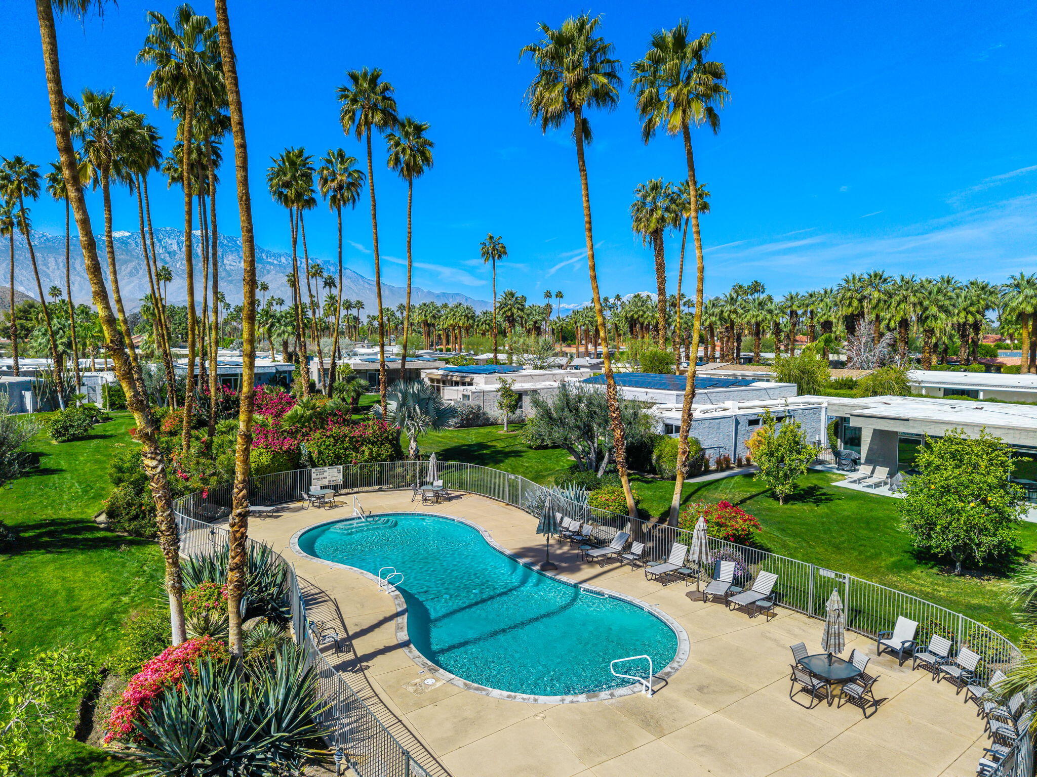 1408 Tamarisk W Street Rancho Mirage, CA 92270 - Photo 43 of 43 a view of a swimming pool and lounge chairs